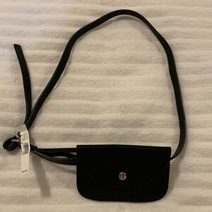 NWT Black Leather Waist Pouch. Strap adjusts to 30”. Great for travel.‌